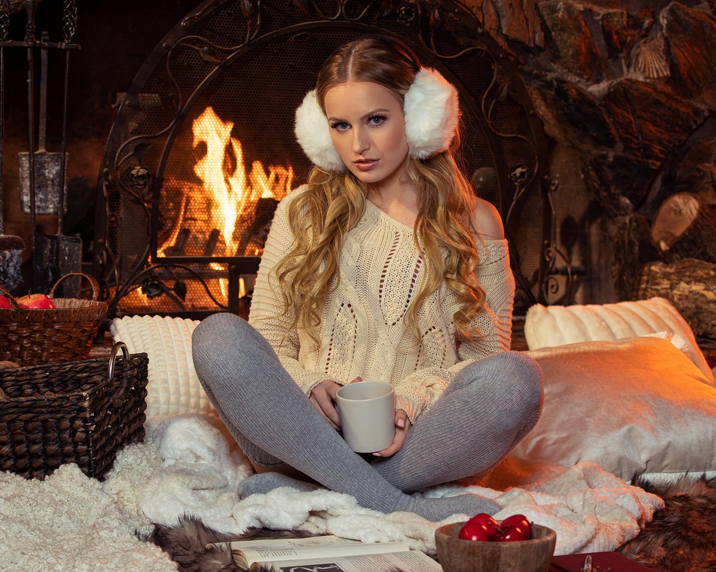 Playboy Newcomer (Scarlet Sage): Newcomer, Scarlett Sage, makes a stunning debut with this cozy fireside pictorial from the photographer, Holly Randall. Set up for the perfect winter night in, Scarlett is on set dressed in lingerie, a sweater, thigh-high socks, and ear muffs as our cameras capture her.