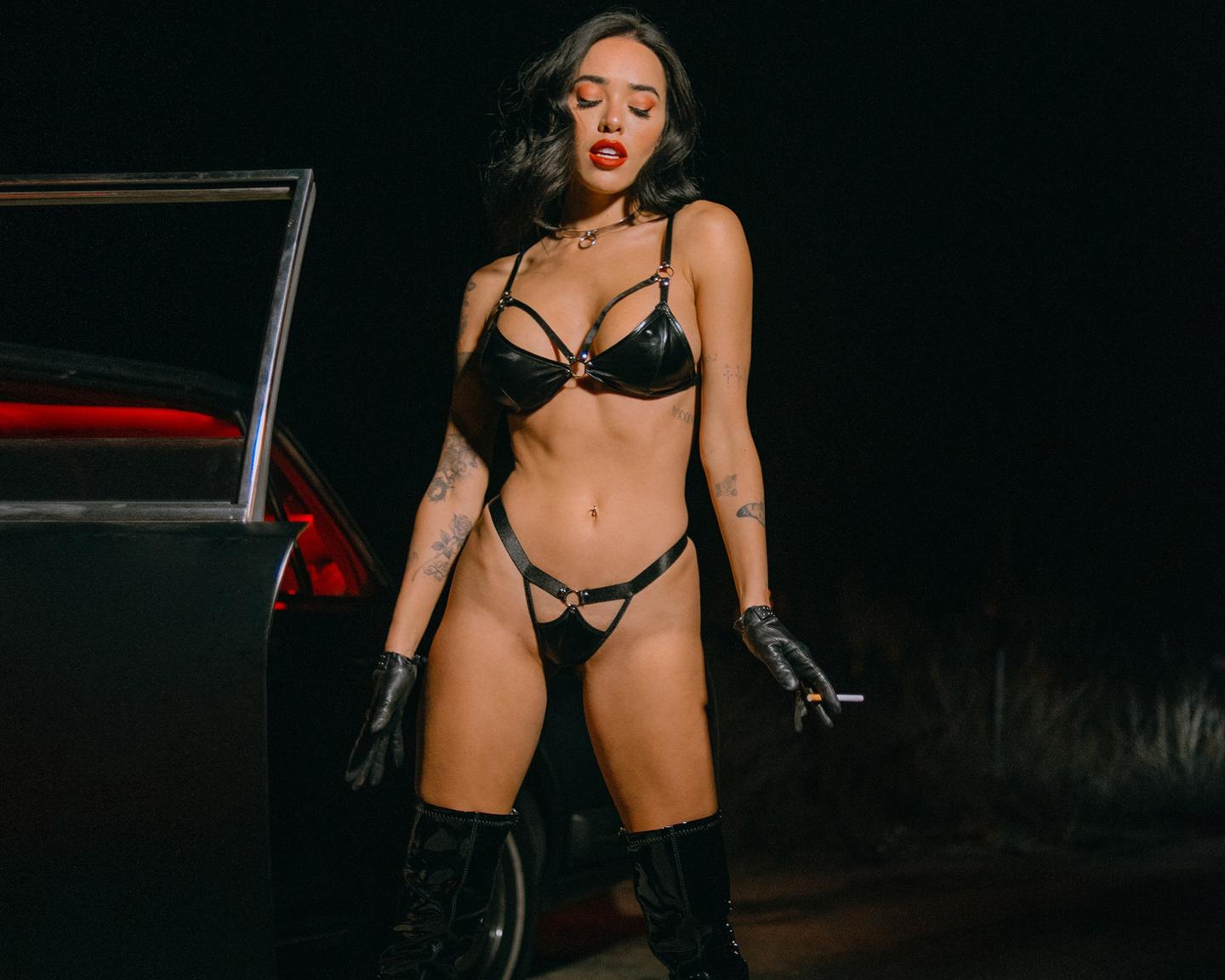Playboy Muses (Lily Andrews in Late Night Ride): Up for a late-night drive with Lily Andrews? Get on the road with her in this dark and ultra-sexy pictorial shot by the photographer, Tina Louise. Dressed in all black leather, Lily pulls over for her close-up. Make sure to check out all of Lily Andrews’ pictorials right here.