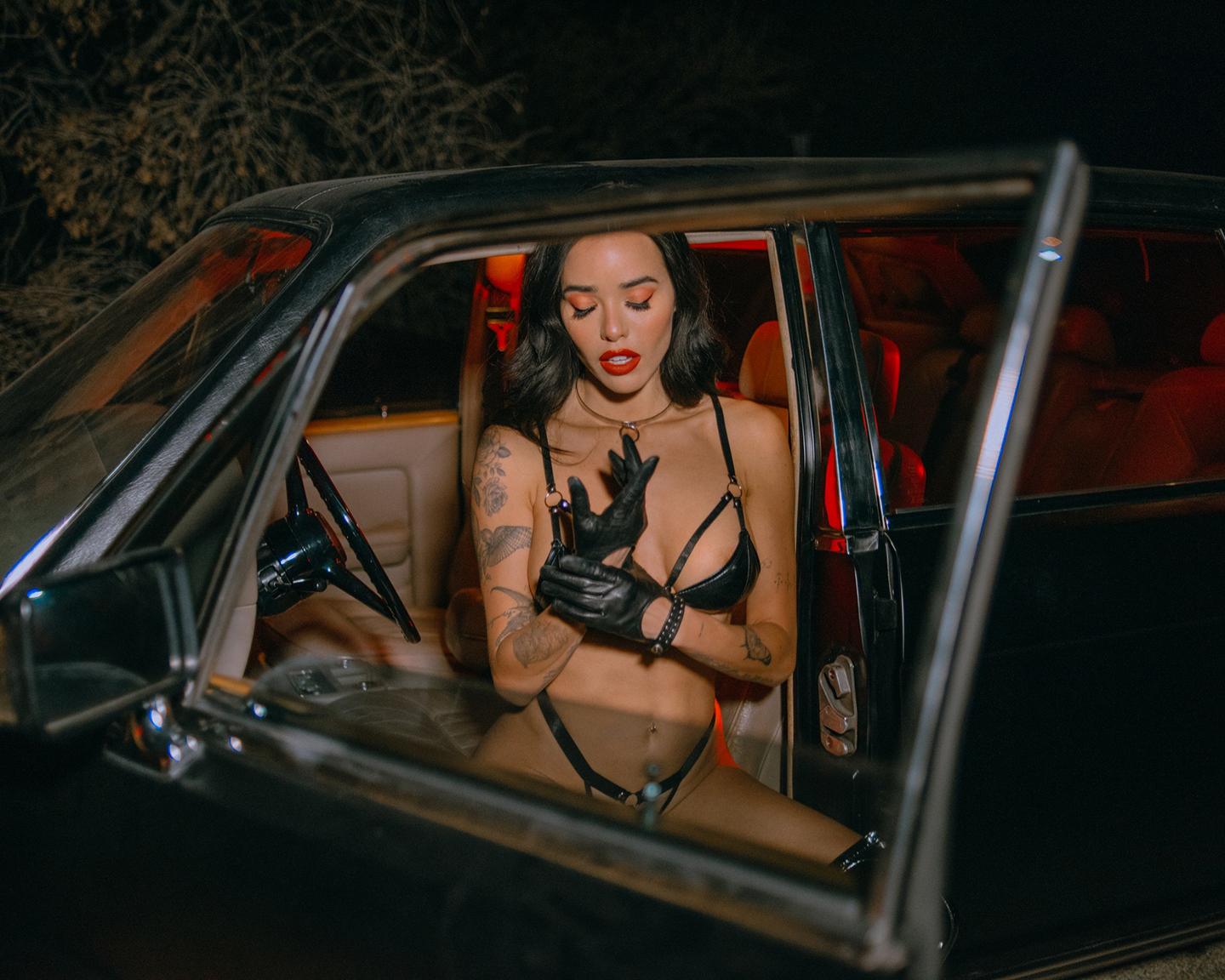 Playboy Muses (Lily Andrews in Late Night Ride): Up for a late-night drive with Lily Andrews? Get on the road with her in this dark and ultra-sexy pictorial shot by the photographer, Tina Louise. Dressed in all black leather, Lily pulls over for her close-up. Make sure to check out all of Lily Andrews’ pictorials right here.