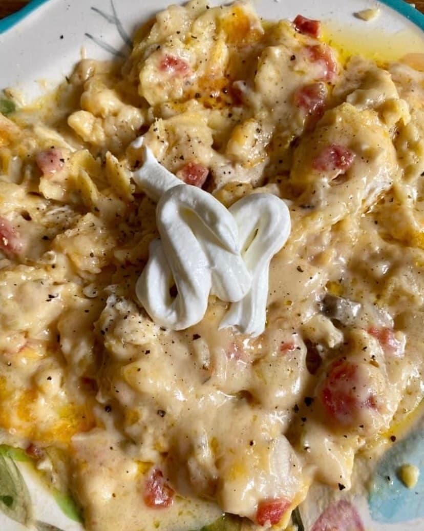 Brooke Christine's mom's chicken casserole on a plate with sour cream.